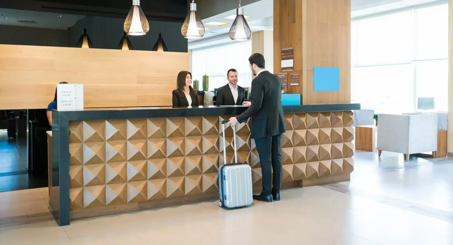 Man Checking in at Hotel