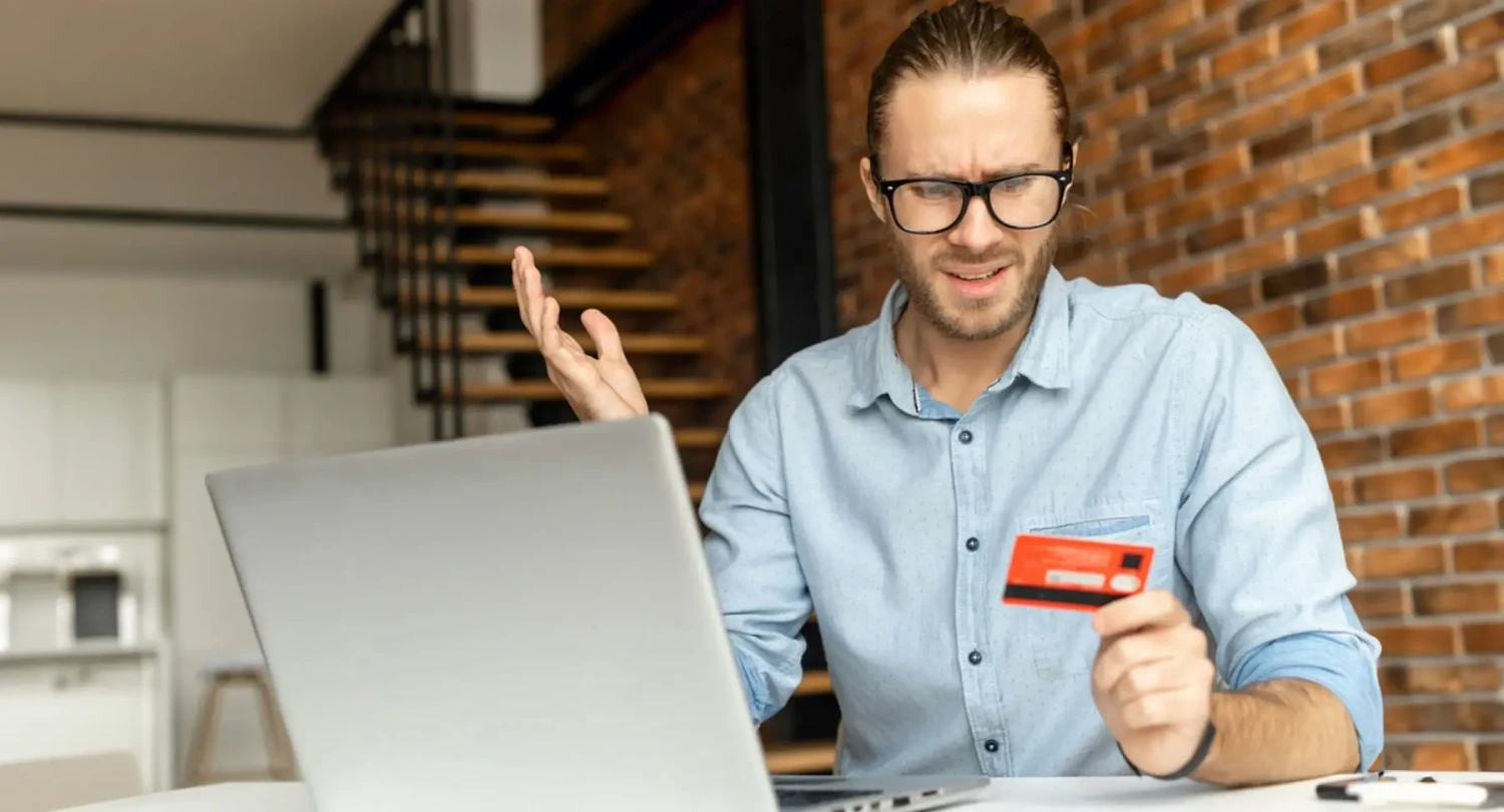Man with Glasses Upset About Card Fraud